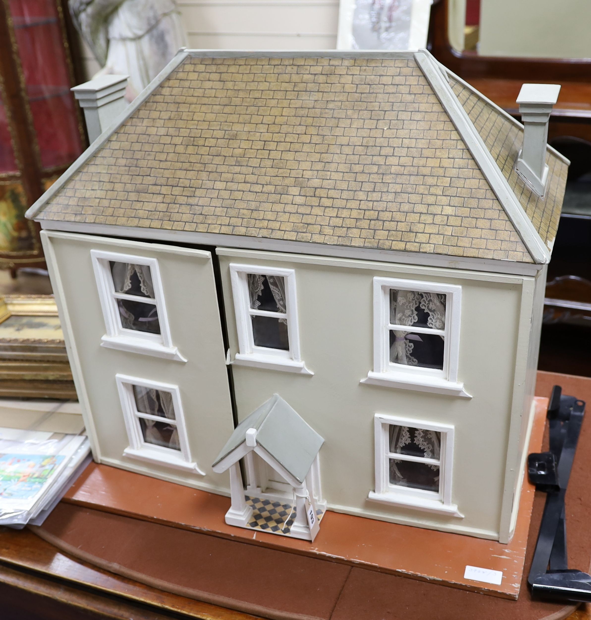 A dolls house, length 74cm, depth 39cm, height 66cm